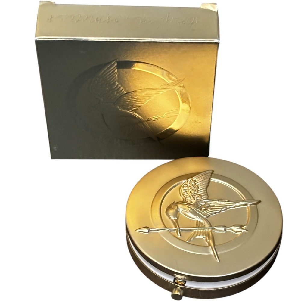 Storybook Cosmetics Hunger Games Girl on Fire Pressed Powder Highlighter Gold